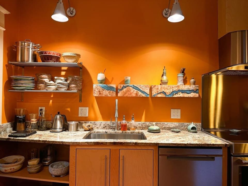 Kitchen with wooden cabinets and open shelves
