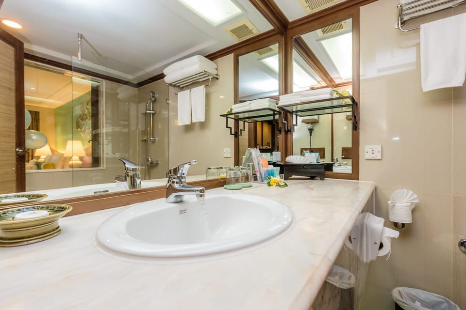 Regency Triple Garden view | Bathroom | Shower, hair dryer, slippers, towels