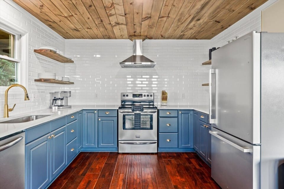 With spacious countertops, updated appliances, and open shelving, the kitchen makes gathering, cooking, and sharing meals together effortless throughout your stay.