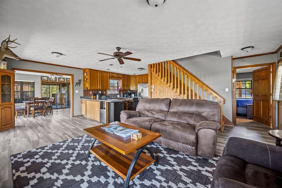 Spacious open-concept living space, seamlessly flowing into the modern kitchen and inviting dining area. Perfect for entertaining and relaxing alike