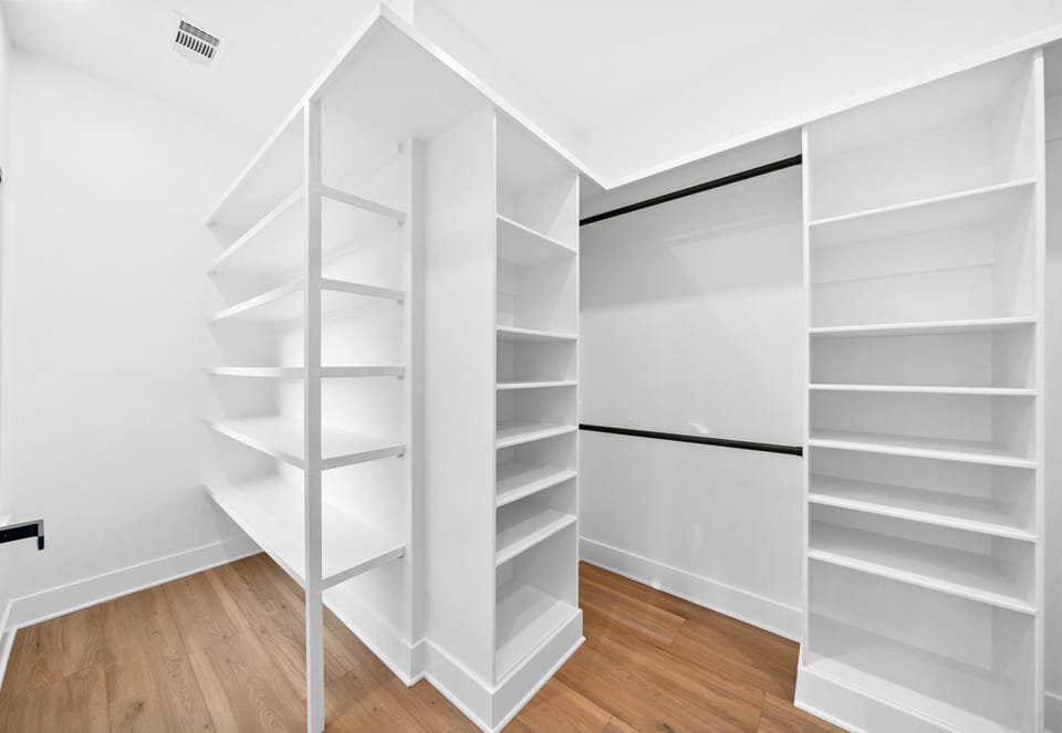 Every fashion lover's dream closet. Plenty of room for clothes, shoes, and accessories.