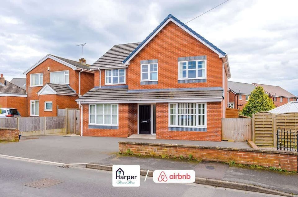 Modern brick-built detached home with large front windows.
Spacious driveway offering convenient off-street parking.
Welcoming design in a peaceful residential area.