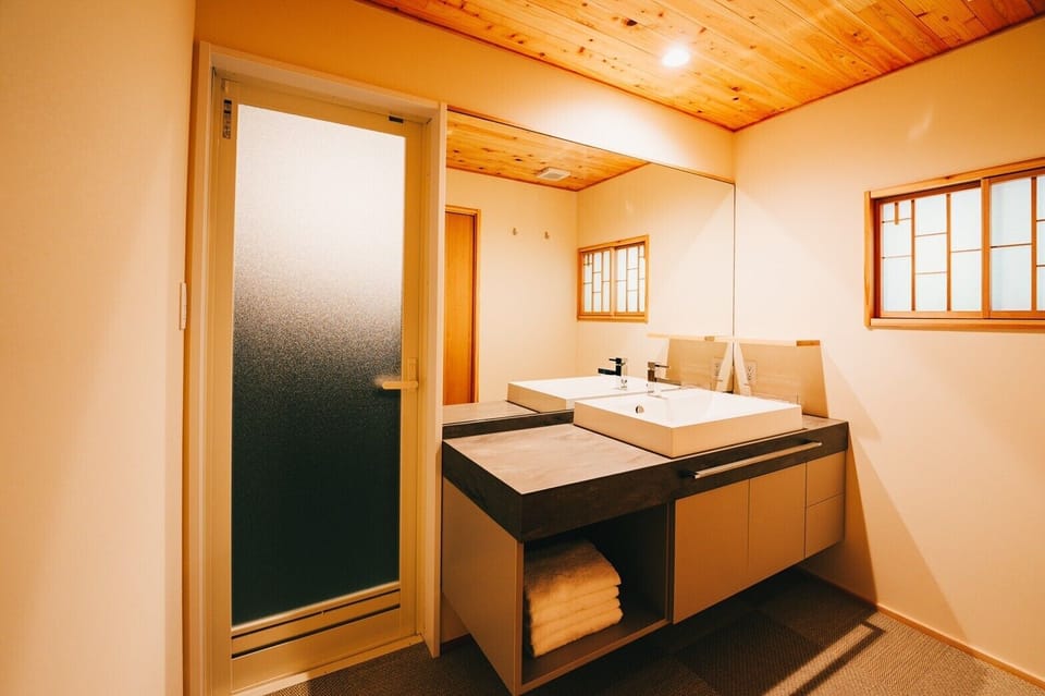 Deep soaking tub, rainfall showerhead, hair dryer, towels