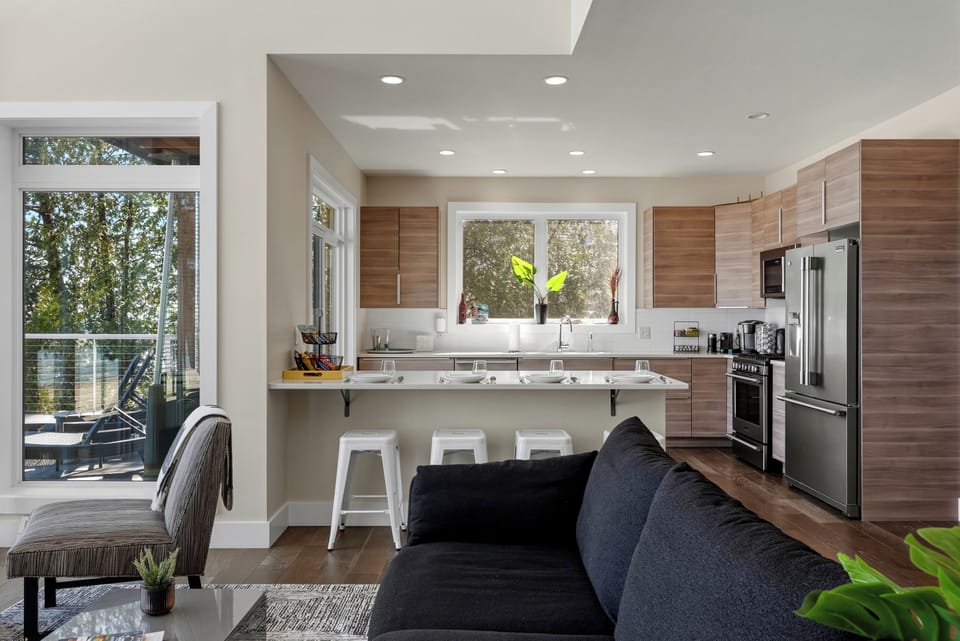 One of two main floor living room areas flows directly to kitchen for convenience. 