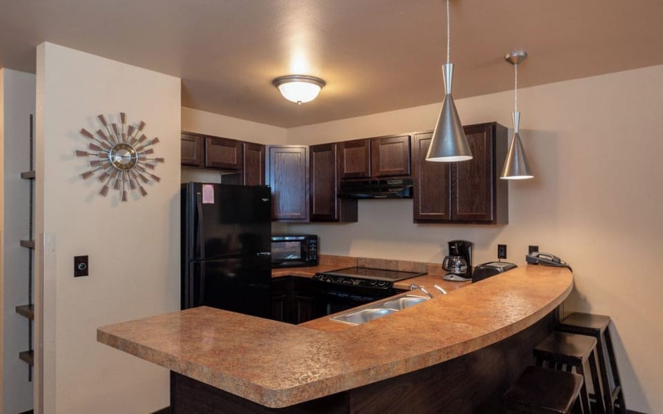 2 Bedroom Condo | Private kitchen | Microwave, coffee/tea maker, cookware/dishes/utensils