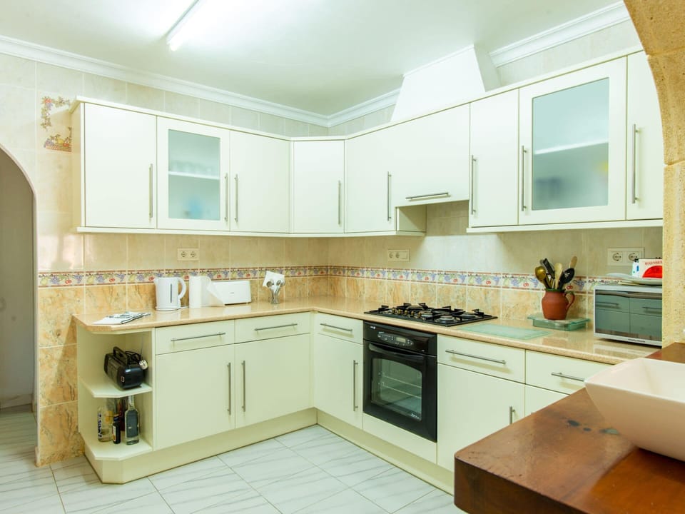 Villa | Private kitchen | Fridge, highchair