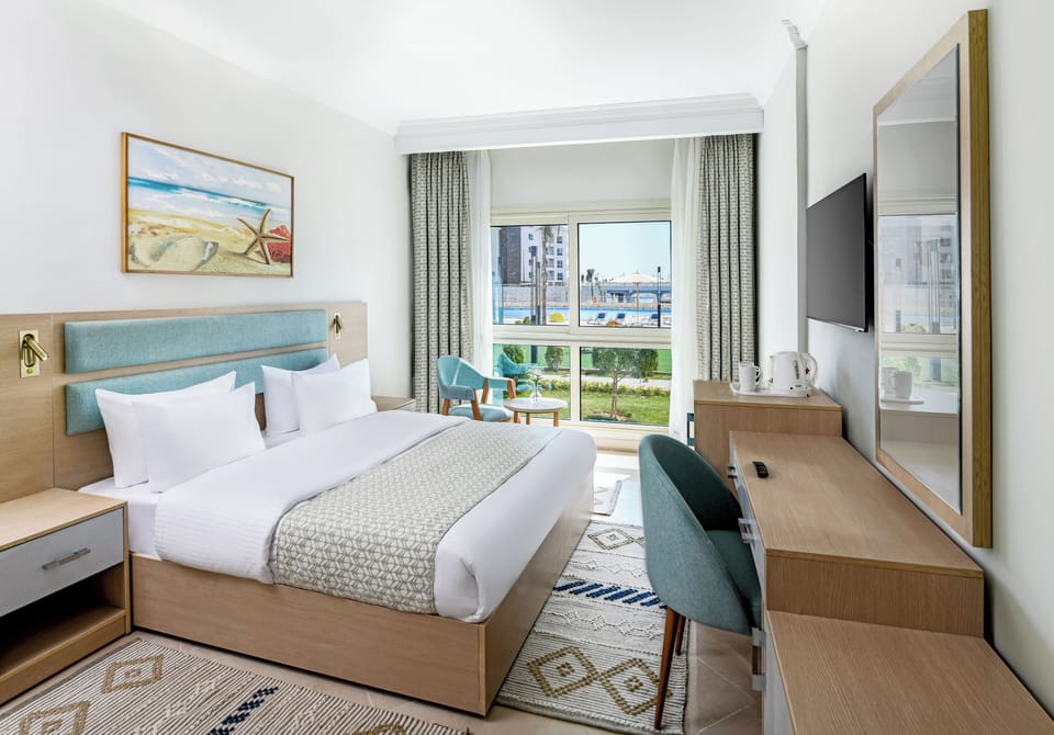 Family Suite, Pool View | In-room safe, individually decorated, individually furnished, desk
