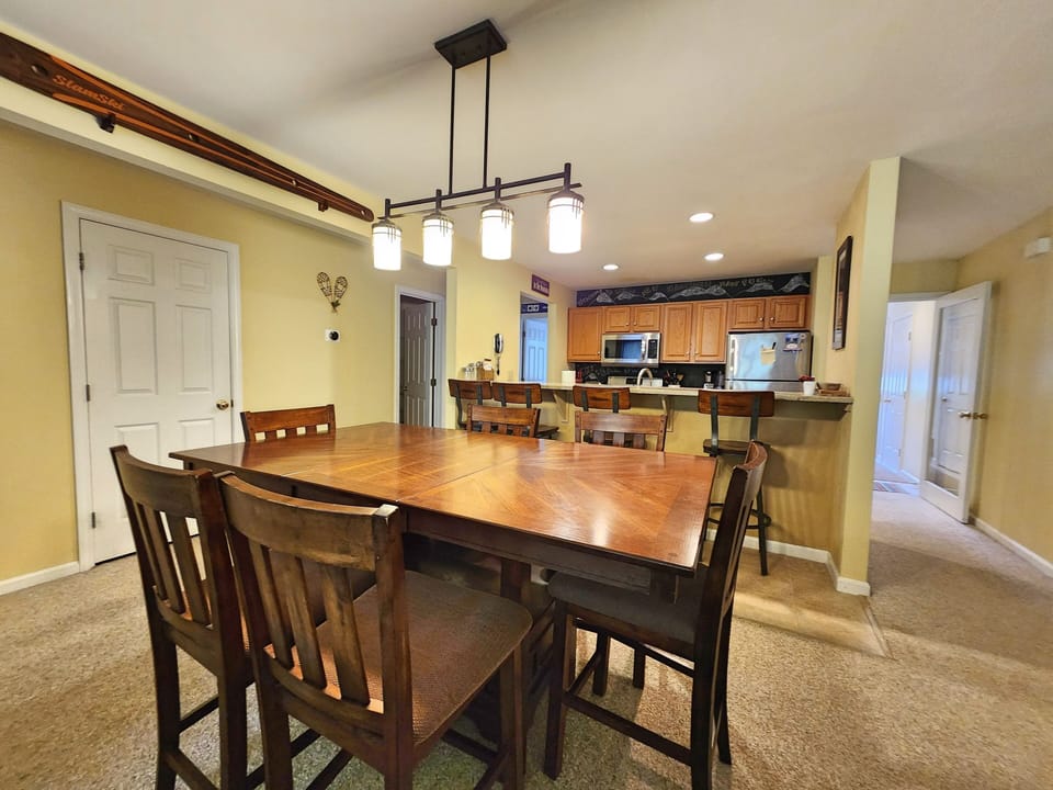 Dining/kitchen area, with entry on right and 2nd bath on left