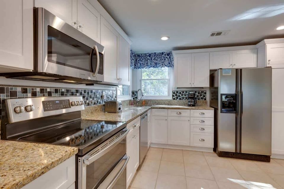Your fully equipped kitchen features granite counters, stainless appliances, and abundant storage for creating memorable vacation meals together.