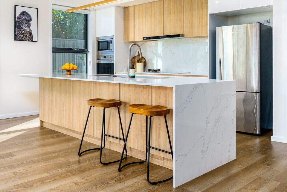 Step into culinary delight in this chic kitchen adorned with stainless steel appliances. Get ready to create cherished memories in this perfect cooking haven.