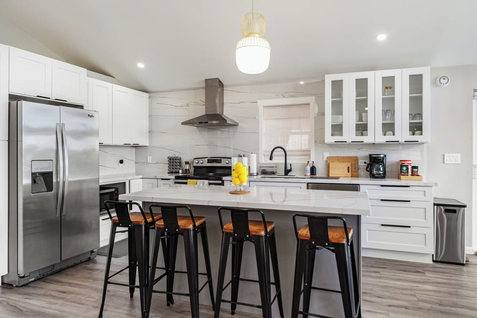 Fully equipped modern kitchen with stainless steel appliances