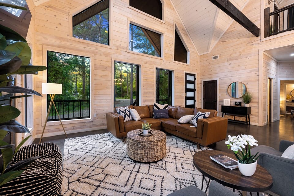 You'll love the tastefully decorated home and large windows opening up the views of the forest