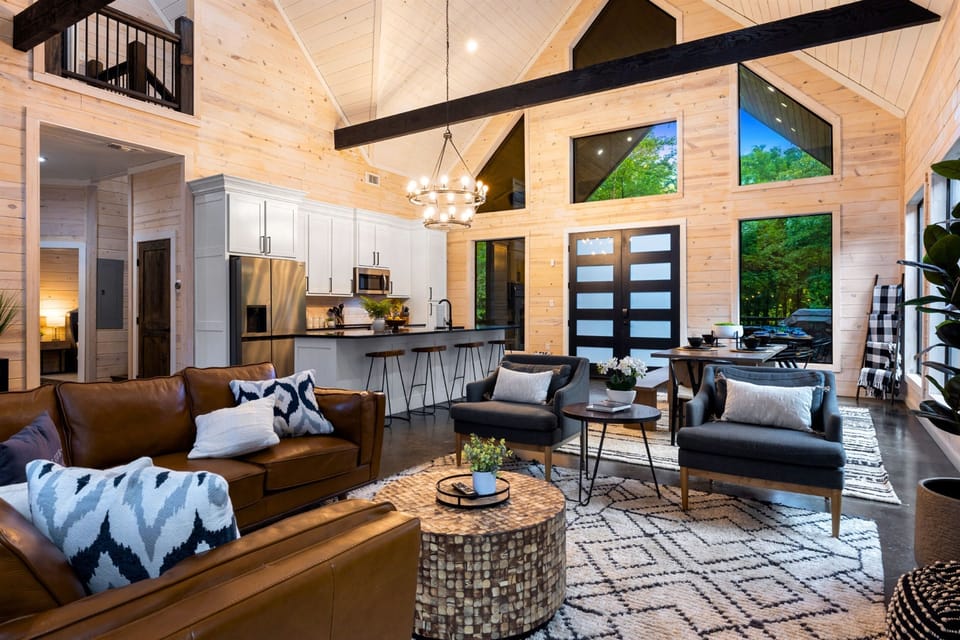 Great living room with vaulted ceilings and large windows 