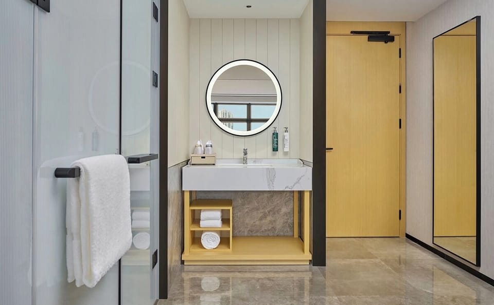 Designer toiletries, hair dryer, bathrobes, slippers
