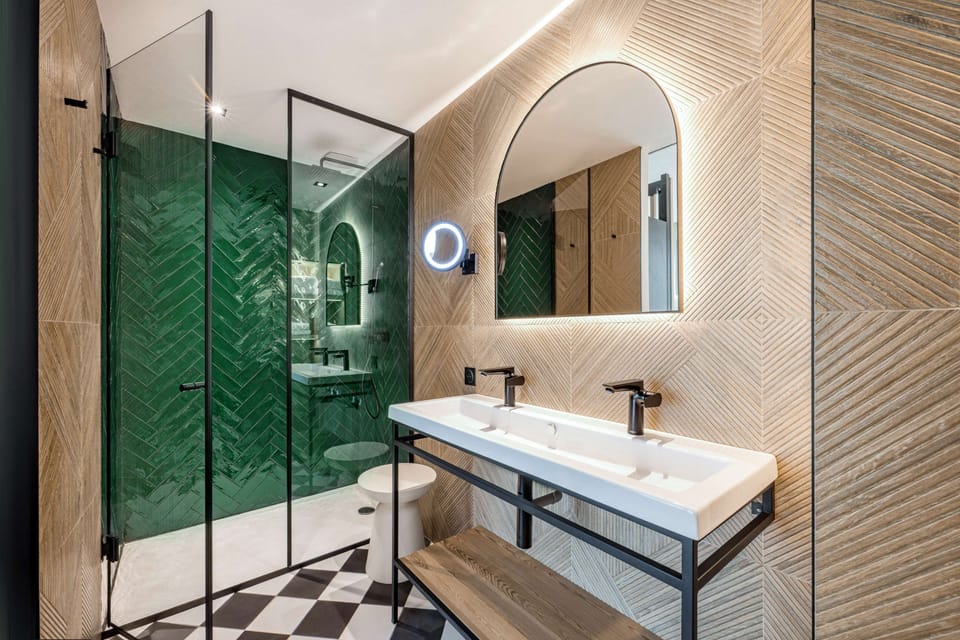 Suite, 1 Bedroom | Bathroom | Shower, rainfall showerhead, hair dryer, bathrobes