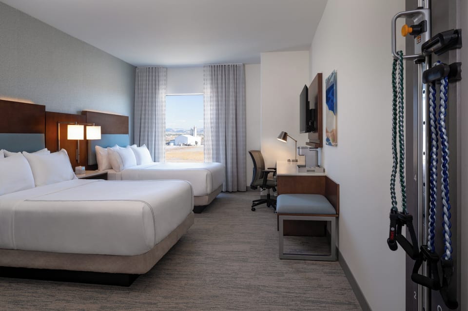 Premium bedding, desk, laptop workspace, iron/ironing board