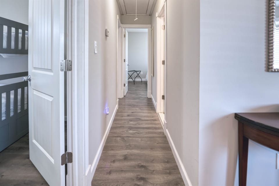 Welcoming hallway that leads to bedrooms and shared spaces