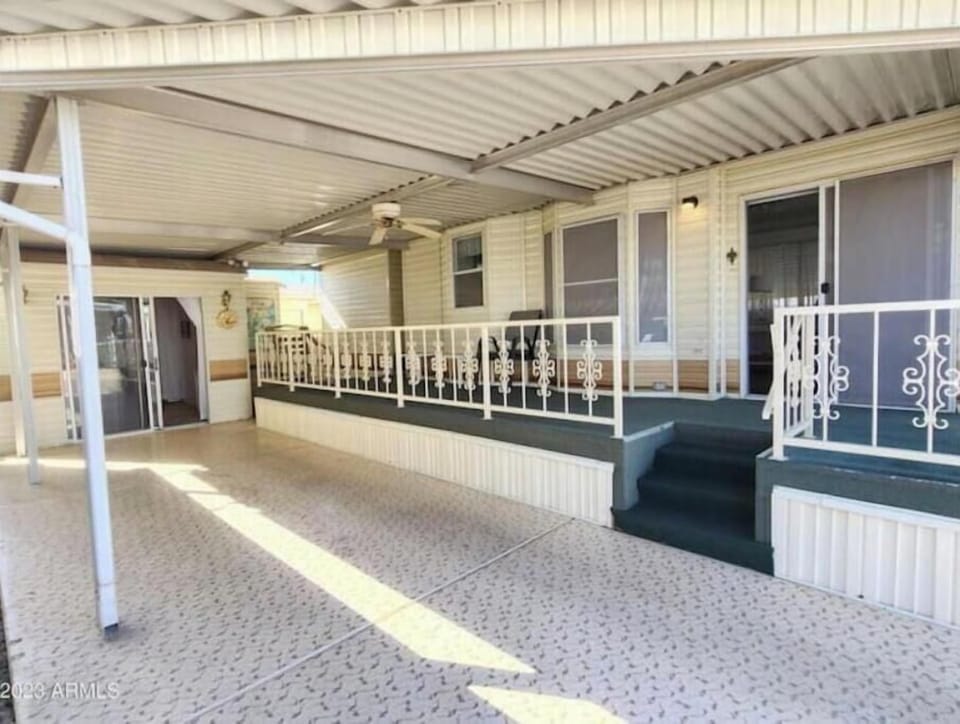 Roomy porch. Carport, detached casita in the background