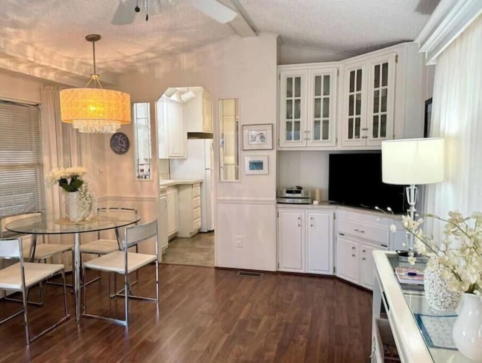 View of dining area and kitchen from recliners