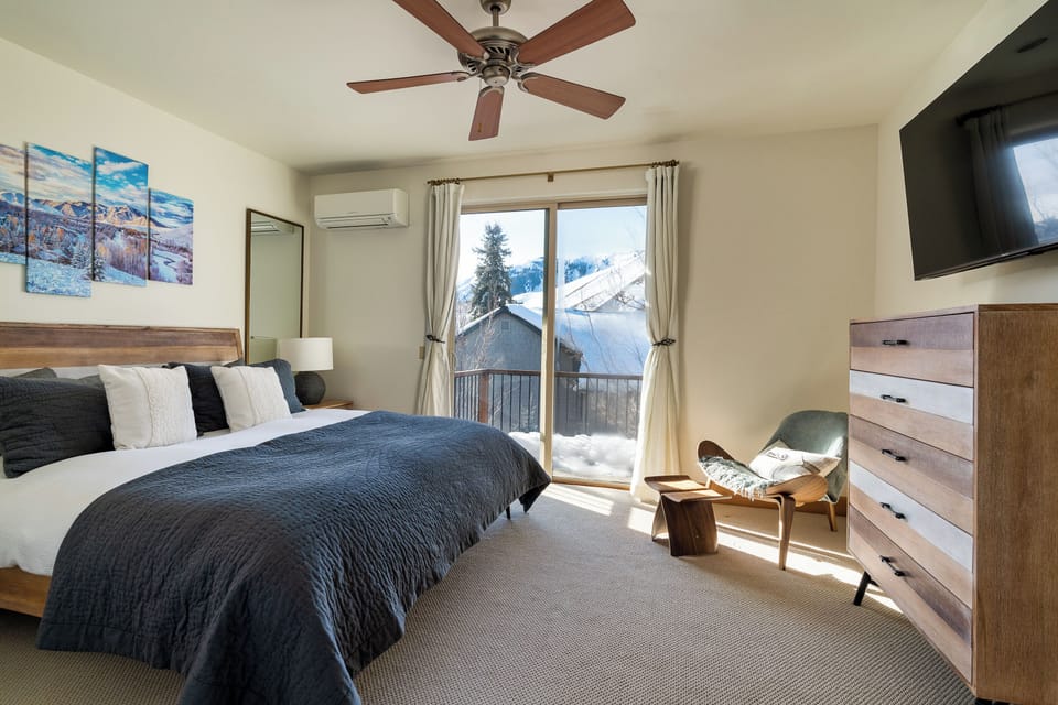 Master bedroom: luxury king mattress, 55 inch smart TV, AC unit, outdoor balcony