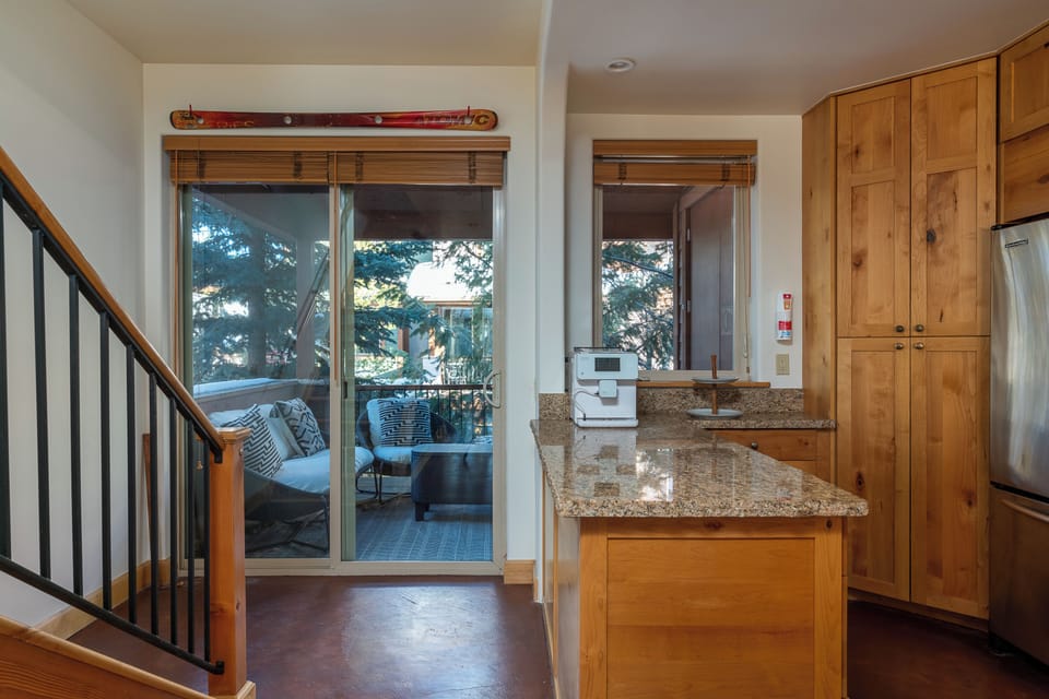 2nd part of kitchen that looks out to the relaxing deck
