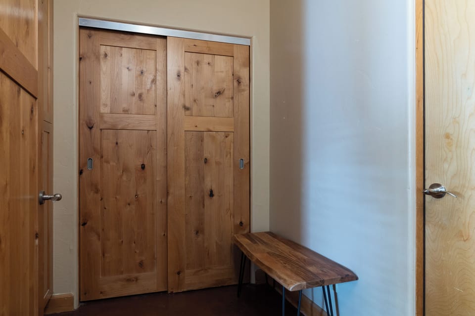 Ground floor mudroom with coat closet and extra storage; adjacent to garage