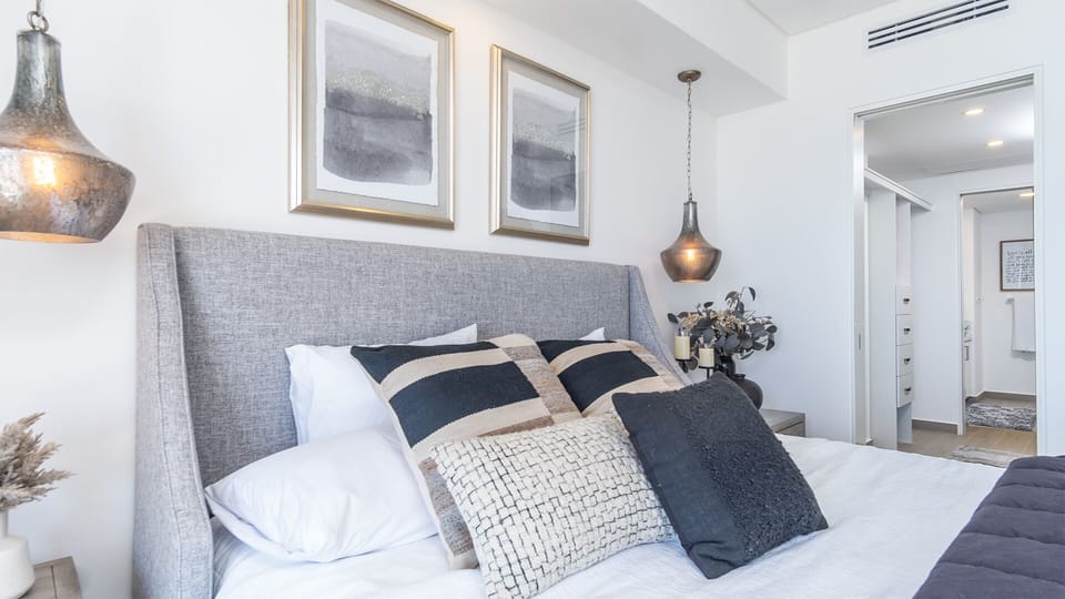 bedroom with attached walk in closet and walk through to the bathroom