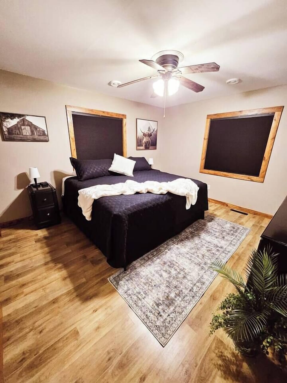 King bed, upstairs on main floor.  Ceiling fan.  Small fan for noise or temperature control.  Room darkening shades.  Extra blankets and pillows.  Large closet with hangers.  TV and dresser with mirror.