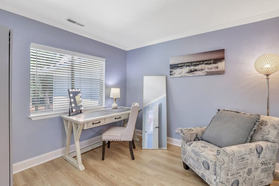 Bedroom 2 -  king-size bed, a smart TV, sitting area with a desk and vanity mirror, plus a spa like ensuite with a walk-in shower
