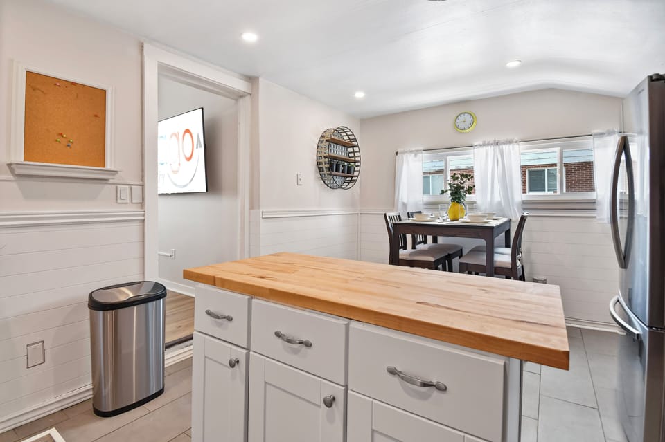 A newly remodeled and nice sized kitchen with butcher block countertops and center island