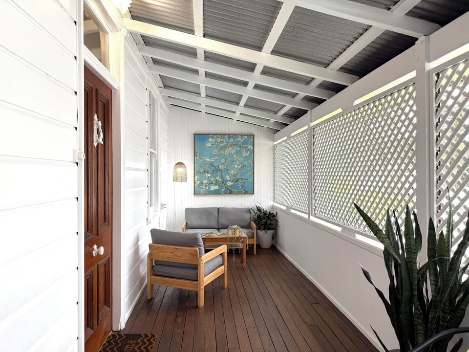 The verandah offers a cozy and quiet spot to relax with a coffee or a book.