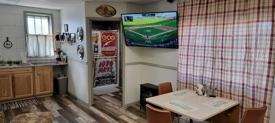 Large TV and Cozy Dining Table
