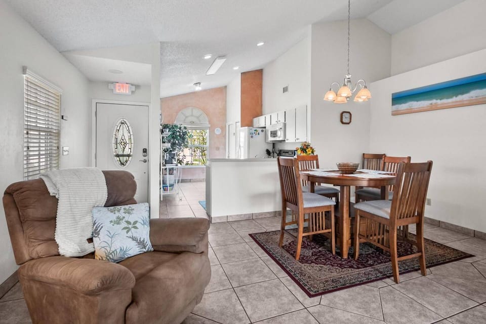 Welcome to Sea Vista! Experience the open concept living and dining area, which seamlessly overlooks the patio.