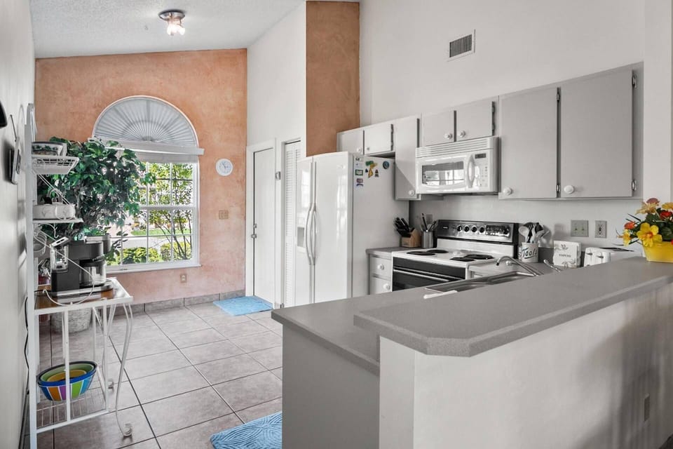 The kitchen is fully equipped with a refrigerator, microwave, range & dishwasher, along with all the essential you need for a comfortable stay.
