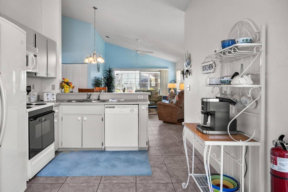 The kitchen is fully equipped with a refrigerator, microwave, range and dishwasher, along with all the essential you need for a comfortable stay.