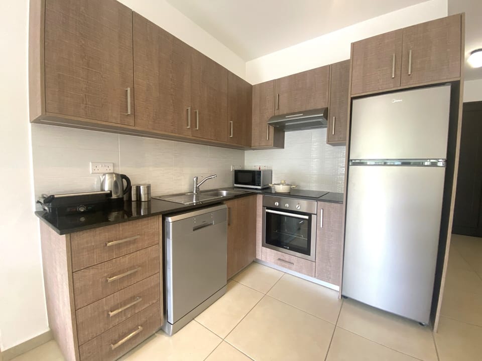 Apartment, Non Smoking, Pool View | Private kitchen | Highchair