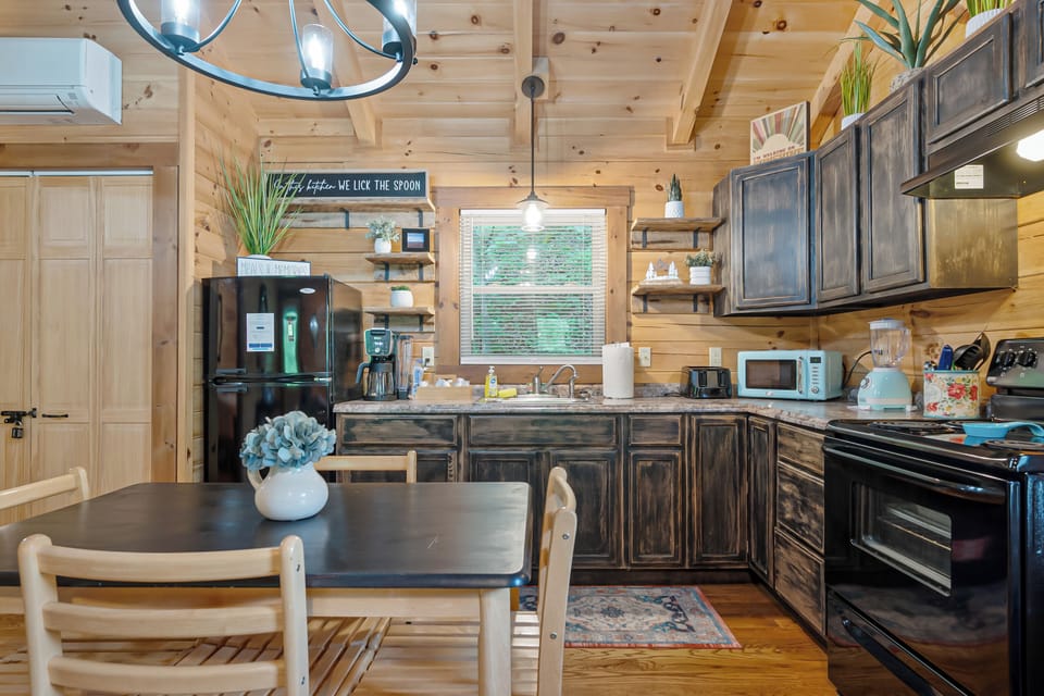 Fully equipped rustic kitchen and dining nook—perfect for cooking and gathering.