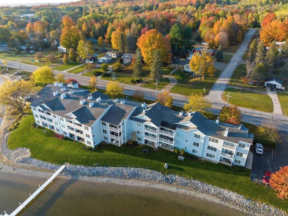 Your condo is the lower right corner condo. Walk out from back door to your patio and lawn. 

Park in the lot where you see the white SUV in the photo (on the right).