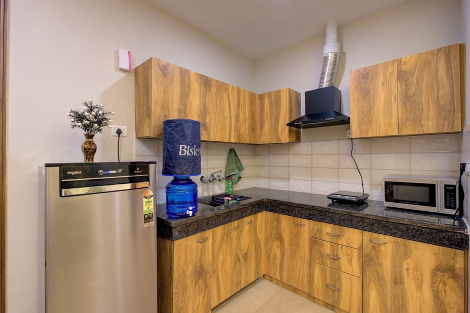 Luxury Apartment | Private kitchen | Fridge, microwave, electric kettle, toaster
