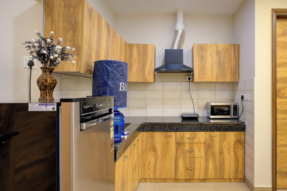 Luxury Apartment | Private kitchen | Fridge, microwave, electric kettle, toaster