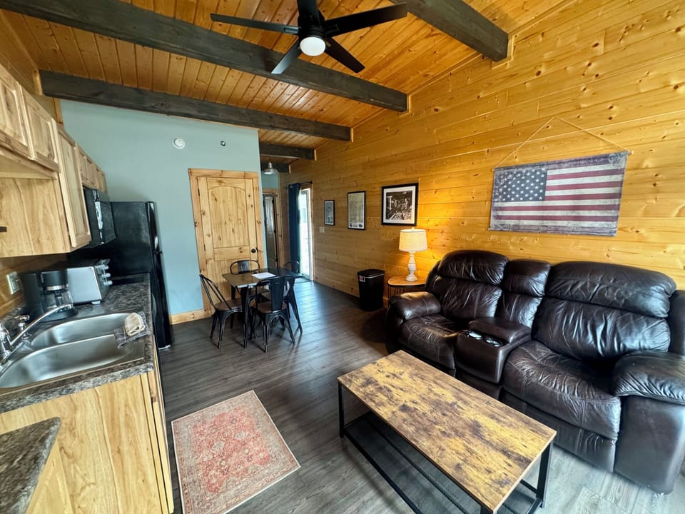 Living space with love seat couch.