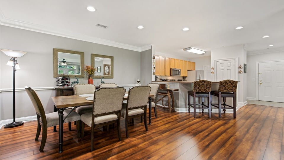 The dining room table seats six comfortably, along with kitchen bar seating 