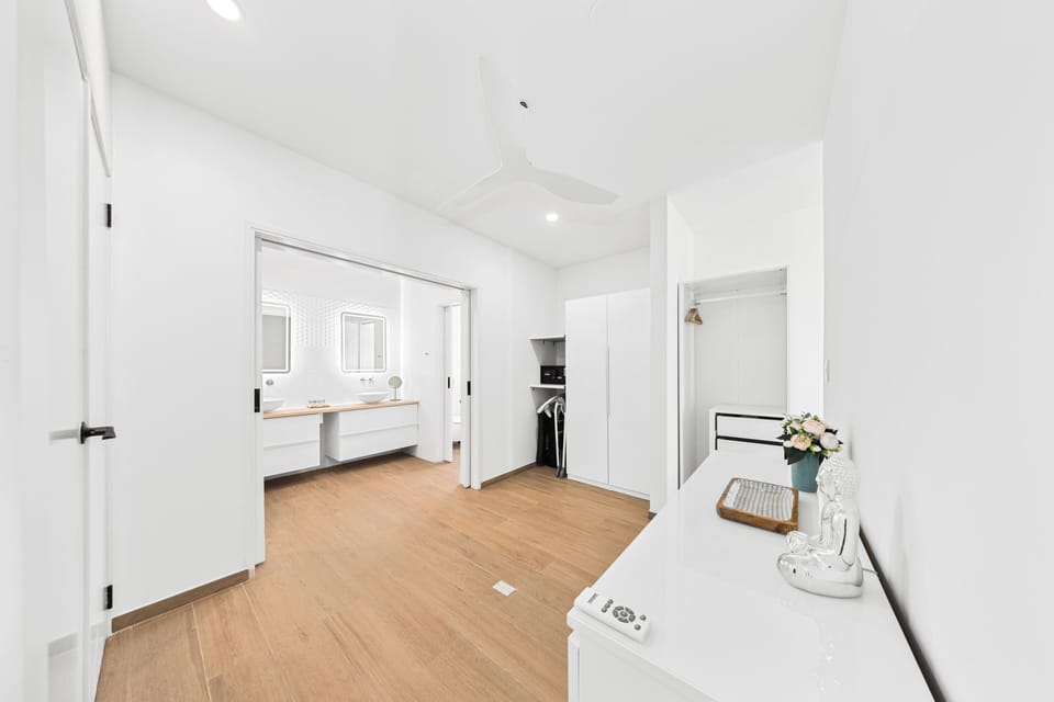 Experience the elegance of bathroom of the home in Noord, Aruba - Enjoy the seamless blend of style and functionality in our walk-in shower - Beautiful dual sink vanity with all bathroom amenities - Refresh yourself on neat and clean toilet seat