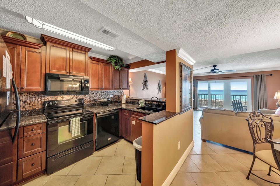 The fully equipped kitchen features granite countertops and has everything you need to prepare meals for family and friends.
