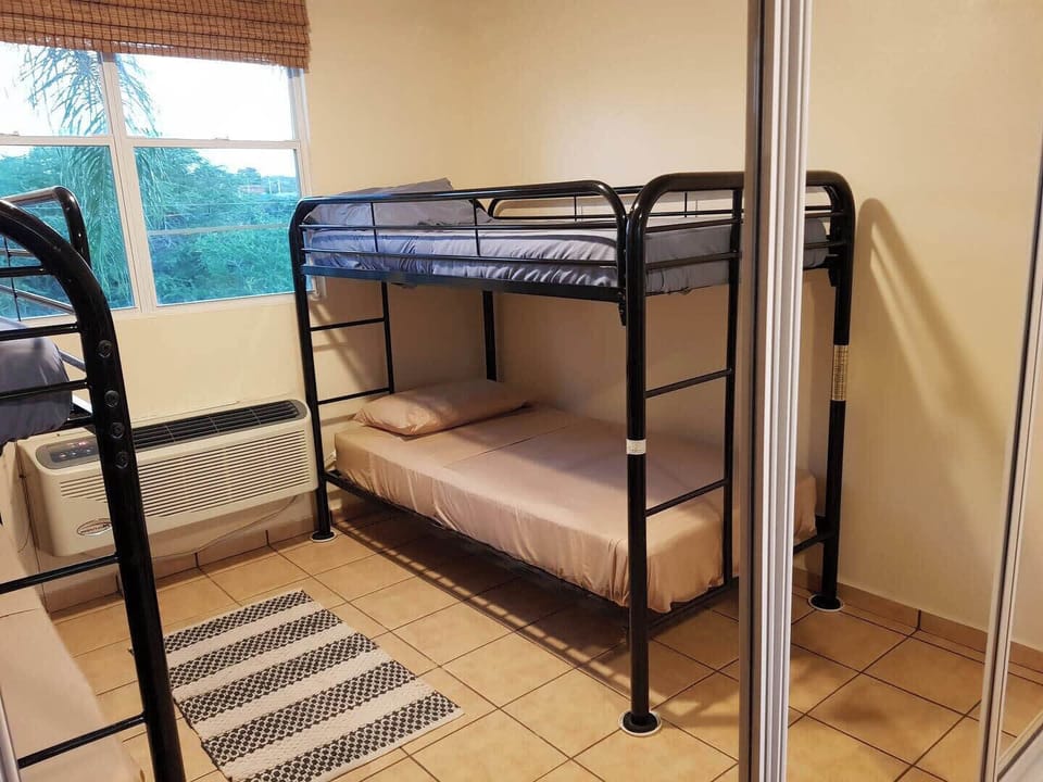 Bedroom 3 has 4 Single beds (2 sets of bunk beds)
