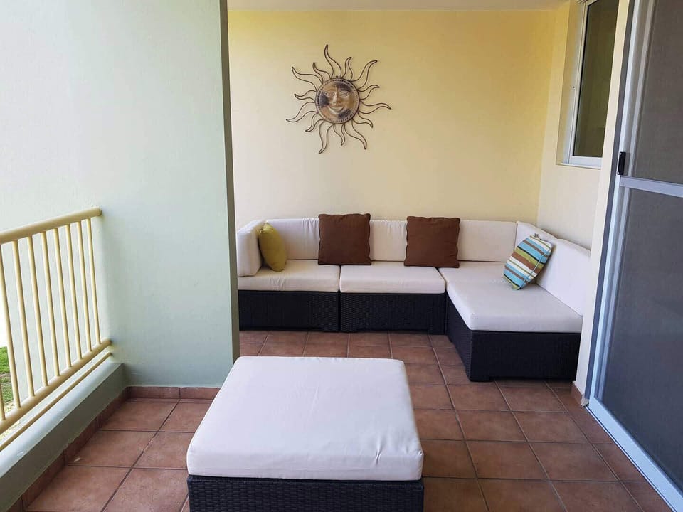 Your private balcony has comfy, cushioned seating