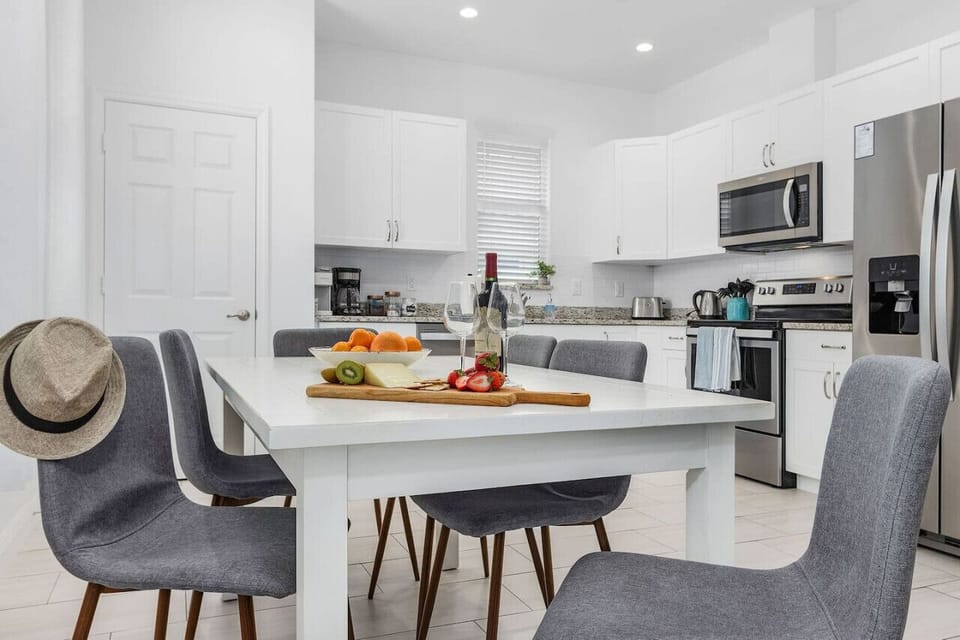 Open plan living area and well equipped kitchen, with toaster, coffee maker, keurig, coffee grinder, and all the major appliances.