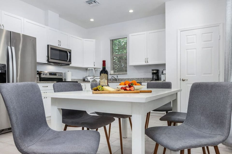 Open plan living area and well equipped kitchen, with toaster, coffee maker, Keurig, coffee grinder, and all the major appliances.