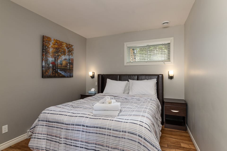 Rest easy in a queen-sized bed after a day of exploring Charlevoix.