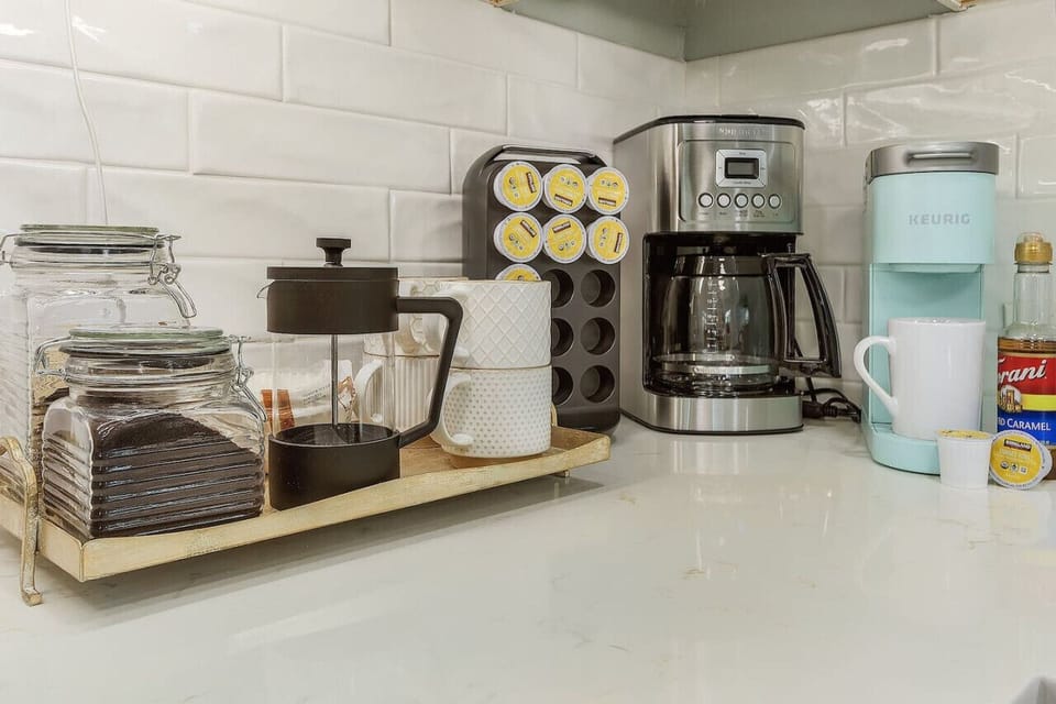 Fully equipped coffee station with Keurig, Filter coffee machine, and French Press. Starter amounts of coffee, pods and sugar provided.